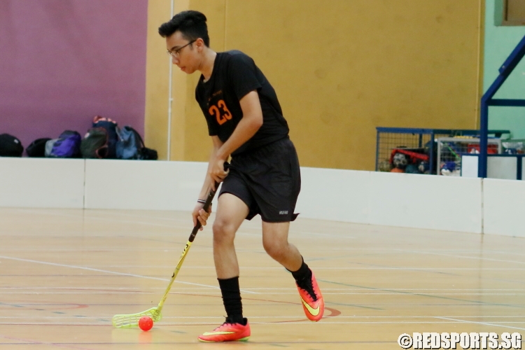 Muhammad Zharfan Muhammad M (SCS #23) dribbling the ball upcourt. He contributed 3 goals in the 28-0 victory over APS. (Photo 1 © REDintern Chan Hua Zheng)