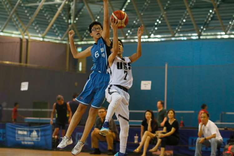 Ethan (Unity #7) goes up for a layup under heavy pressure from Glen (Bukut Panjang #6). 