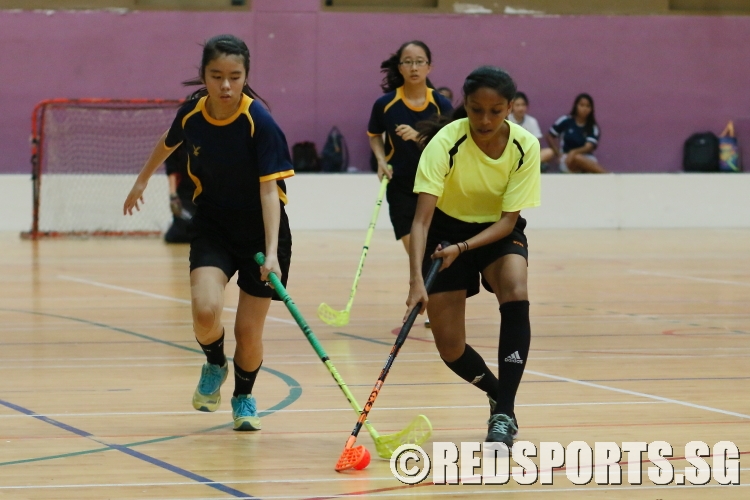 A Bukit View player fending off her defender as she tries to retain possesion of the ball. (Photo  © REDintern Chan Hua Zheng)