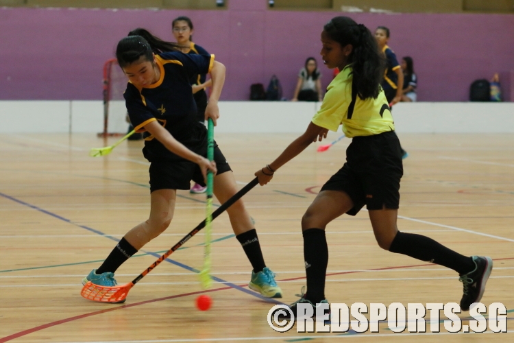 A Kent Ridge player is contested by her defender as she fires a shot. (Photo  © REDintern Chan Hua Zheng)
