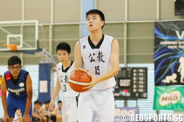 Keith (CHS #15) looks to shoot against Punggol Secondary. He bagged a team-leading 11 points. (Photo  © REDintern Dylan Chua)