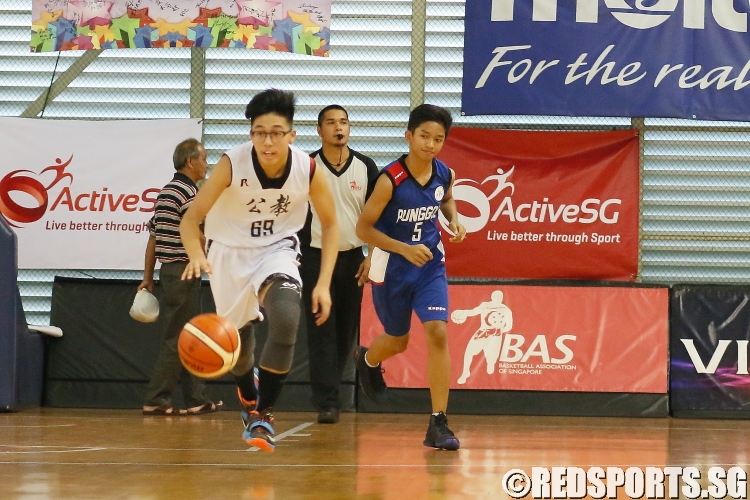 Evan (CHS #69) advances the ball against Punggol Secondary. (Photo  © REDintern Dylan Chua)
