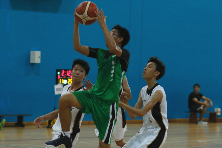 A CCK player going up for a layup on a fast break.