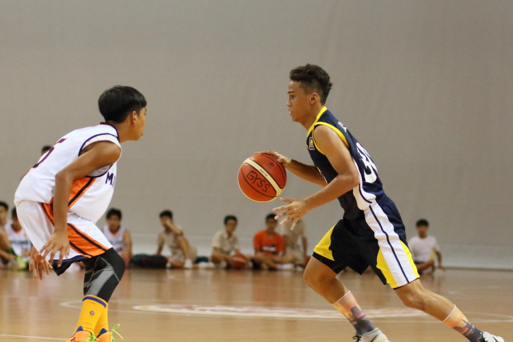#30 of Guangyang looking to  drive past the Mayflower defense. He scored 12 points in the game.