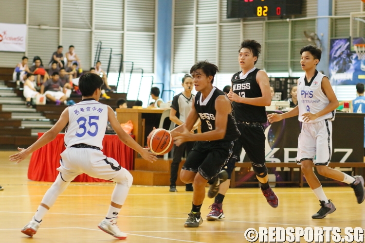 Daryl (NBS #5) looking for an opening as he drives through the PHS defense. (Photo  © REDintern Chan Hua Zheng)