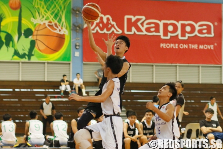 A NBS player rising up for a layup over the PHS defense. (Photo  © REDintern Chan Hua Zheng)