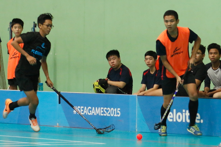 An AES player dribbles by his defender. (Photo 8 © REDintern Chan Hua Zheng)