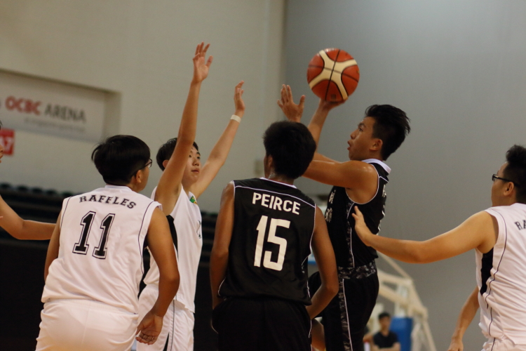 Ryan Tan (Pierce #4) attempting a floater over the RI defense. He led his team in scoring with 16 points.