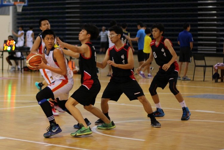 (ACSBR#2) being tightly guarded by defender (Peicai#13) (Photo 3 © REDintern Adeline Lee)