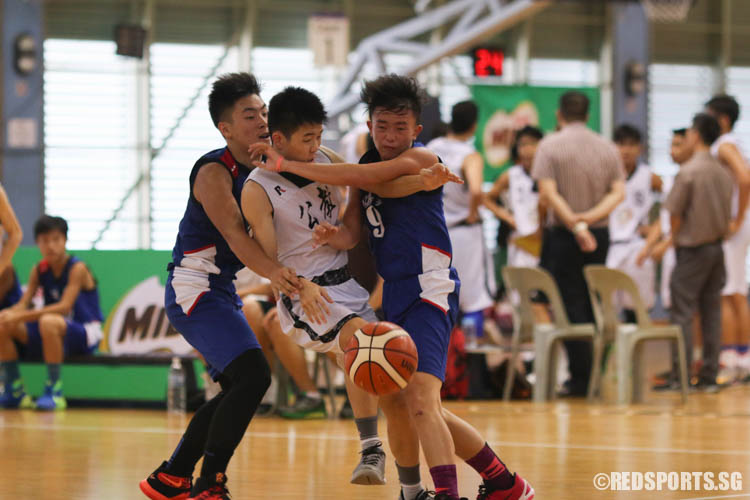 Players crash into each other as Travis Thong (CHS #3) tries to intercept a pass. (Photo 5 © REDintern Chua Kai Yun)
