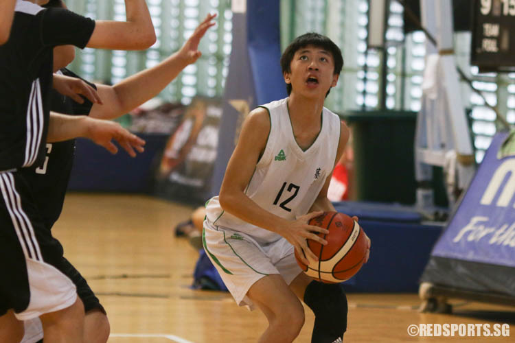 Oscar Ong (CCS #12) performs an under basket shot. (Photo 3 © REDintern Chua Kai Yun)