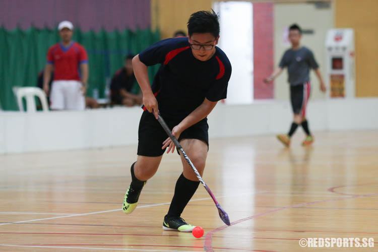 Nicholas Teo (AES #4) steers the ball nearer to the goalpost before firing a shot. (Photo 7 © REDintern Chua Kai Yun)