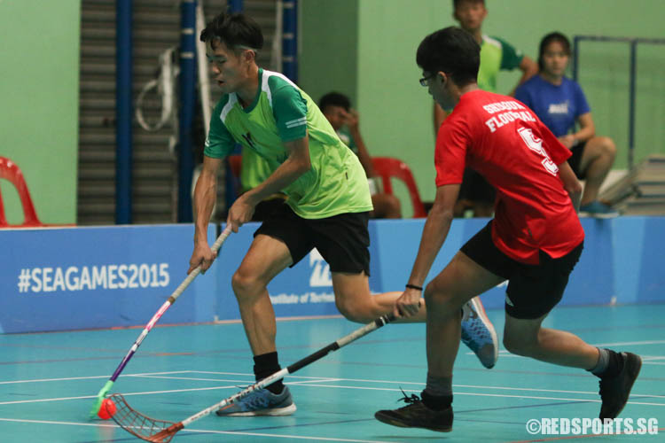 Tan Zhi Kai (OPSS #14) dribbles the ball against his opponent. He was the top scorer of the game, bagging 5 goals. (Photo 1 © Chua Kai Yun/Red Sports)