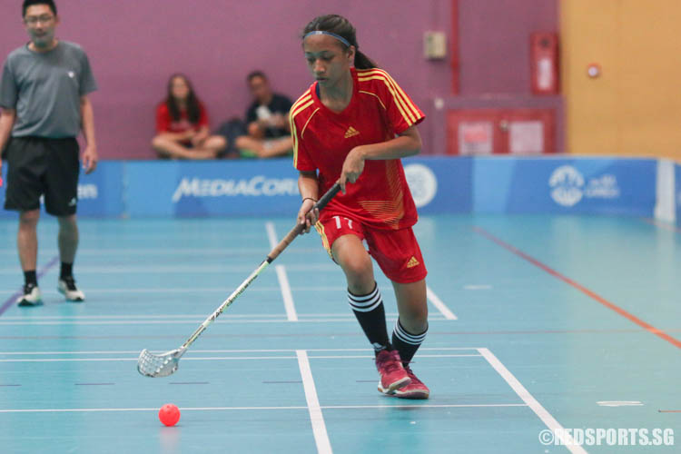 Nureen Farishah (BMSS #11) dribbles the ball on offence. She was the top scorer of the game, bagging 3 points. (Photo 1 © Chua Kai Yun/Red Sports)