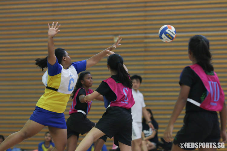 C of Woodlands passes the ball to her teammates. (Photo 3 © REDintern Chua Kai Yun)