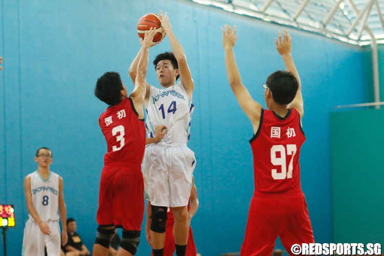 Wilbur Tan (Bowen #14) attempts a jumper in the paint. (Photo 3 © Dylan Chua/Red Sports)