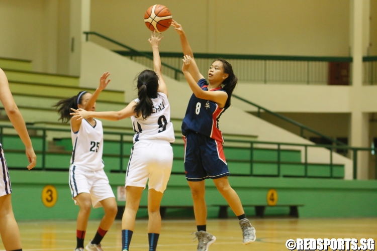 Shermin Moh (Zhonghua #8) takes a heavily contested shot against the defense. (Photo  © Chan Hua Zheng/Red Sports)