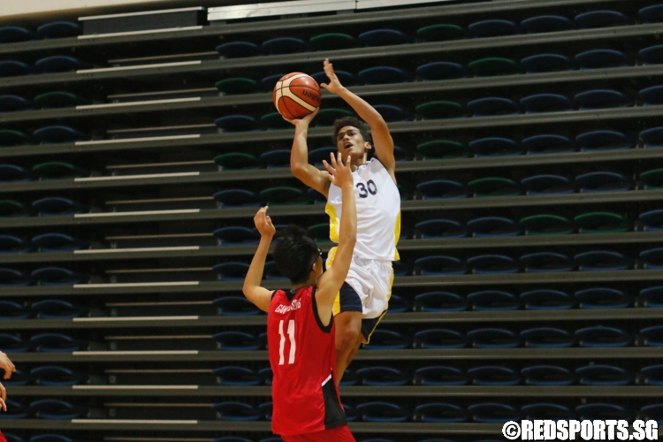 Irfan (Guangyang #30) shoots over his opponent. (Photo  © Dylan Chua/Red Sports)