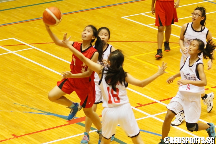 Julie (Mayflower #11) rising for a layup over the defense. (Photo  © Chan Hua Zheng/Red Sports)