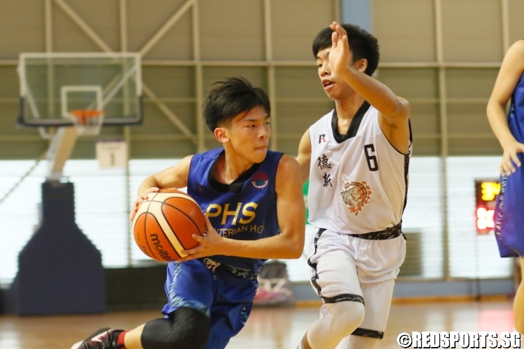 Louis Teh (PHS#6) driving strong to the hoop against his defender. He had 6 points in the game. (Photo  © Chan Hua Zheng/Red Sports)