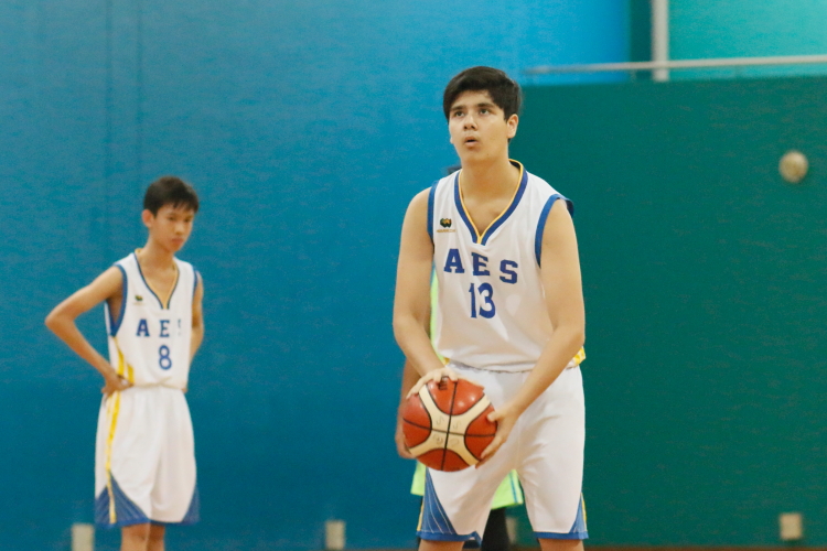 (AES #13) attempts a free-throw. (Photo  © REDintern Dylan Chua)