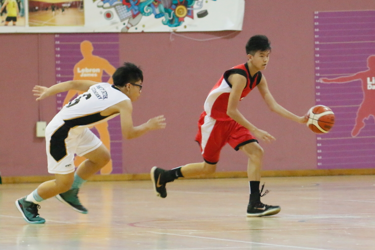 A Yuan Ching player advances the ball against Bukit Batok. (Photo  © REDintern Dylan Chua)