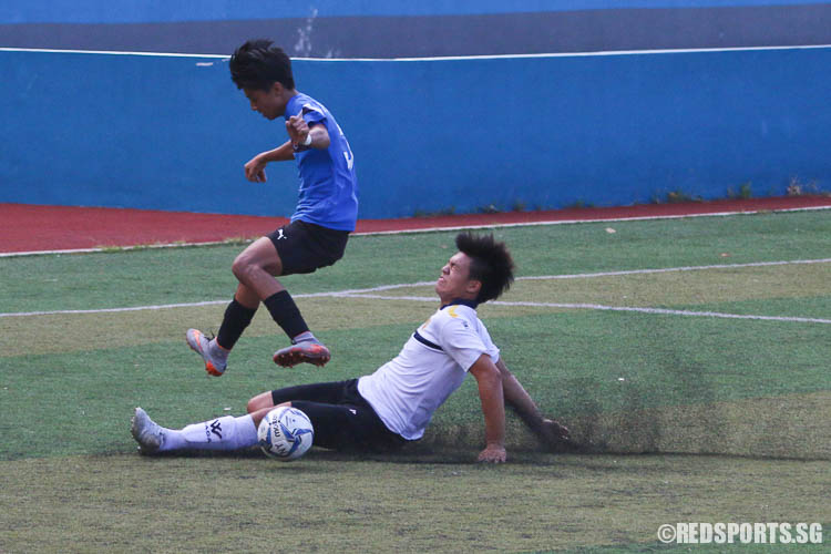 A CJC player slides to intercept. (Photo © Chua Kai Yun/Red Sports)