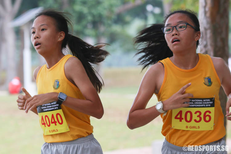 Sarah Koh (#4040) and Anna Crystal Fong (#4036) of Cedar Girls' running in the 3.65km route under the B Division Girls category. Koh finished eighth with a timing of 15:39.76, while Fong came in eleventh with a timing of 15:43:37. (Photo © Chua Kai Yun/Red Sports)