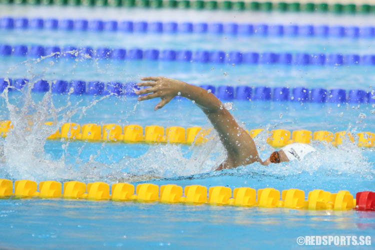 Clydi Chan, 12, completes her 100m freestyle race. She finished first with a timing of 1:01.38, breaking last year's meet record by 0.61 seconds. (Photo 17 © Chua Kai Yun/Red Sports)