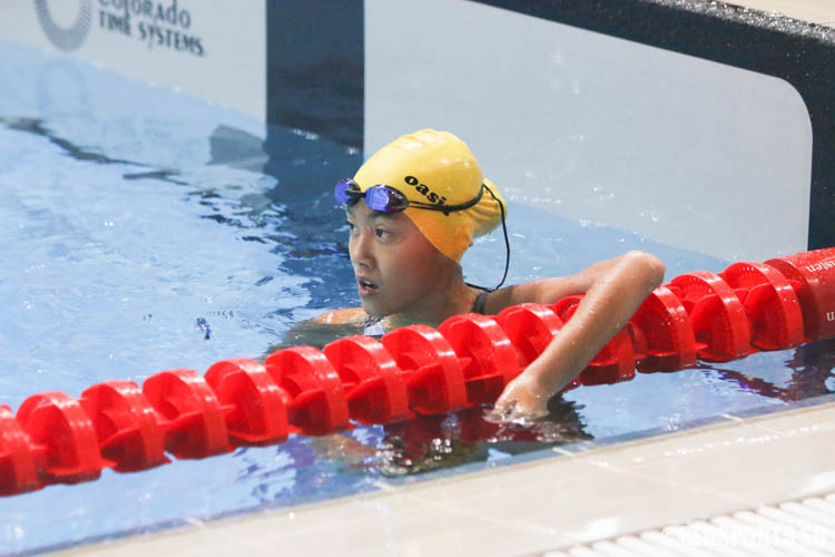 Melaine Chong reacts after the 100m freestyle event. She finished third in the 12 year old age group with a timing of 1:12.24. (Photo 18 © Chua Kai Yun/Red Sports)