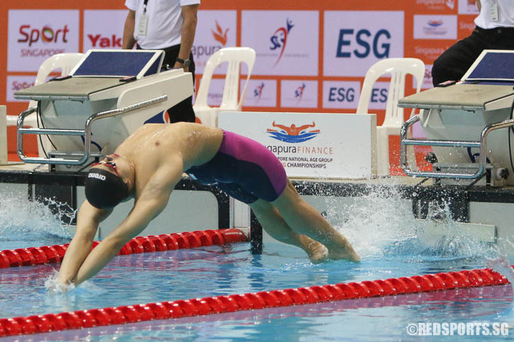 Francis Fong, 16, starting off his 100m backstroke event. He finished first in the 15-17 age group with a timing of 56.91, rewriting his own meet record of 57.45 set last year. (Photo © Chua Kai Yun/Red Sports)