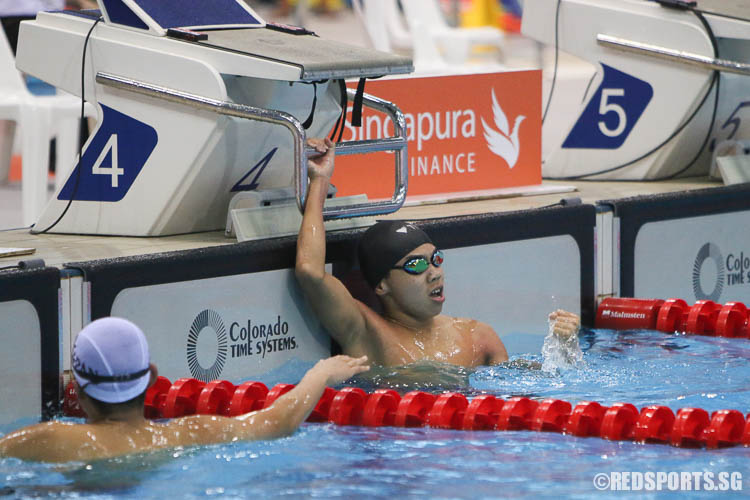 Jonathan Tan celebrates his victory after the men's 100m freestyle race. He came in first in the 13-14 age group with a timing of 52.48, breaking the last meet record of 52.69 set by Darren Chua in 2014. (Photo © Chua Kai Yun/Red Sports)