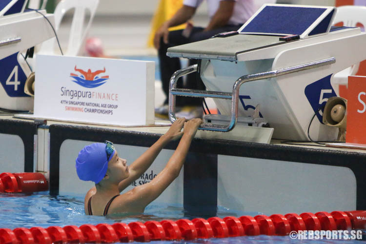 Gan Ching Hwee, 13, reacts after her 400m freestyle event. (Photo 5 © Chua Kai Yun/Red Sports)