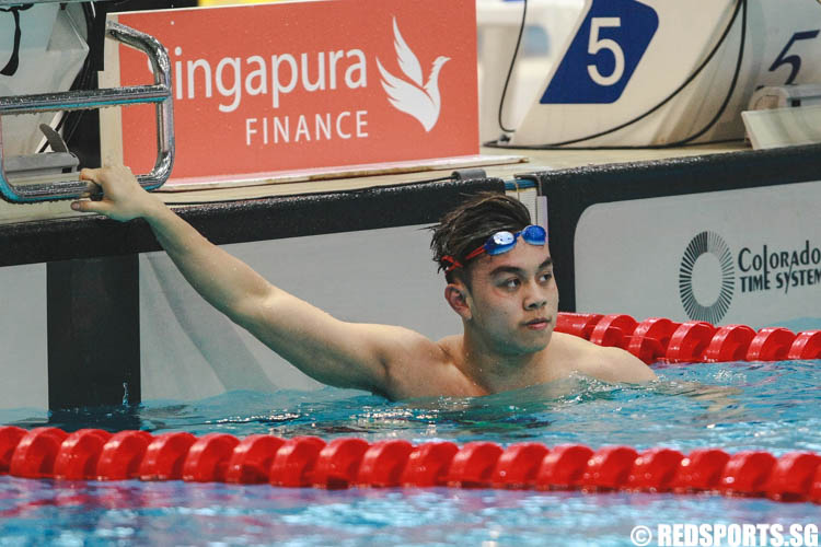 Darren Lim checking his timing after his 15 and over 100m freestyle 'A' finals at the 47th Singapore National Age Group Swimming Championships. He won in the open group with a timing of 50.34. (Photo © Soh Jun Wei/Red Sports)