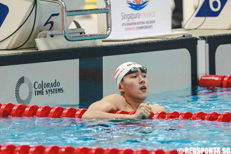 Quah Zheng Wen checking his timing after his 15 and over 100m freestyle 'A' finals at the 47th Singapore National Age Group Swimming Championships. He finished third with a timing of 50.44s. (Photo © Soh Jun Wei/Red Sports)