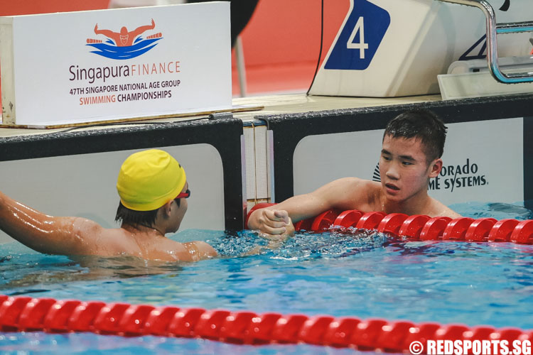 Joshua Ler (L) and Glen Lim (R) share a moment after the mens' 13-14 400m IM 'A' finals at the 47th Singapore National Age Group Swimming Championships. (Photo © Soh Jun Wei/Red Sports)