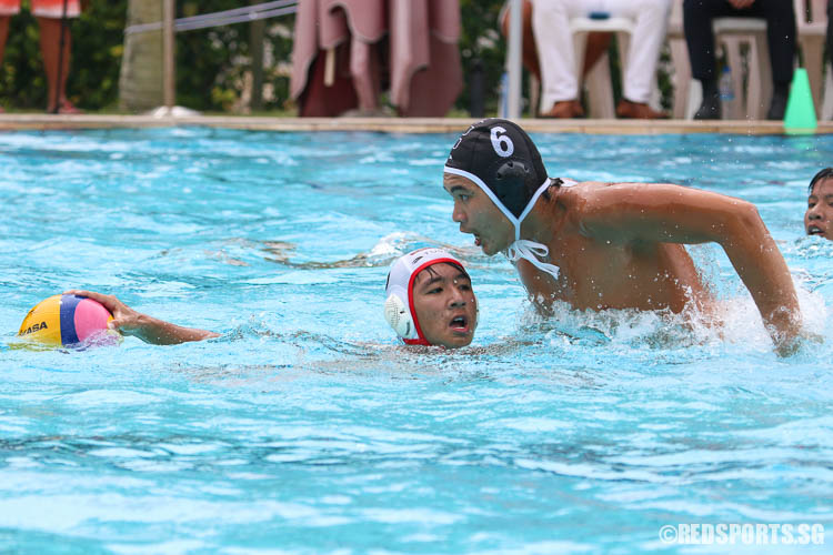 Dominic Koo (OSS #6) tackles Benedict Ong (ACSI #5) to steal possession of the ball. (Photo 4 © Chua Kai Yun/Red Sports)