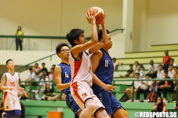 Sherman Seet (ACSB #11) drawing contact as he rises for a layup. He sank 4 3-pointers en route to 20 points. (Photo  © Chan Hua Zheng/Red Sports) 