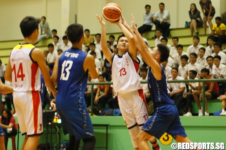 Seat Yue Hent (ACSB #13) takes a tough fadeaway jumper over his defender. (Photo  © Chan Hua Zheng/Red Sports) 