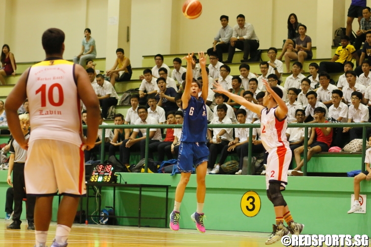 Chay Wen Fu (YYS #6) fires a 3-pointer over Dinesh Allastair (ACSB #2). He sank 4 3-pointers en route to a 21 point performance. (Photo  © Chan Hua Zheng/Red Sports) 
