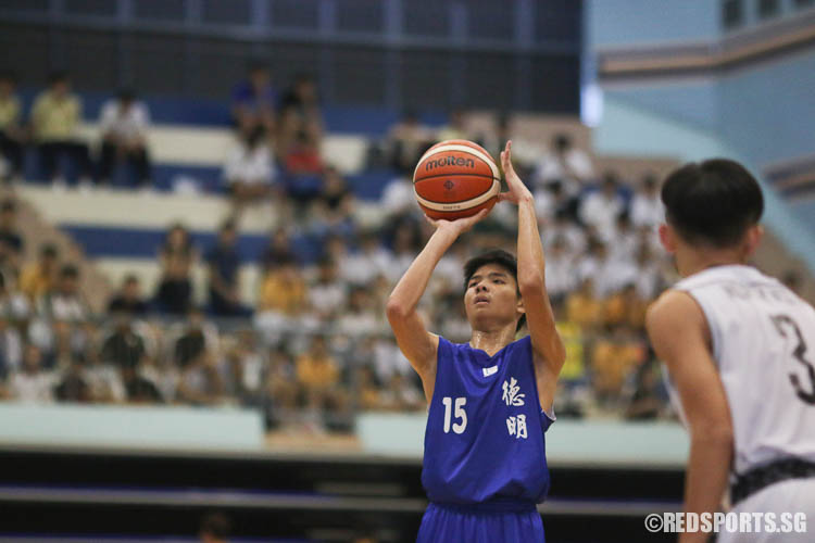 Gabriel Tan (#15) of Dunman goes for a free throw. He scored 10 points for his team. (Photo © Chua Kai Yun/Red Sports)