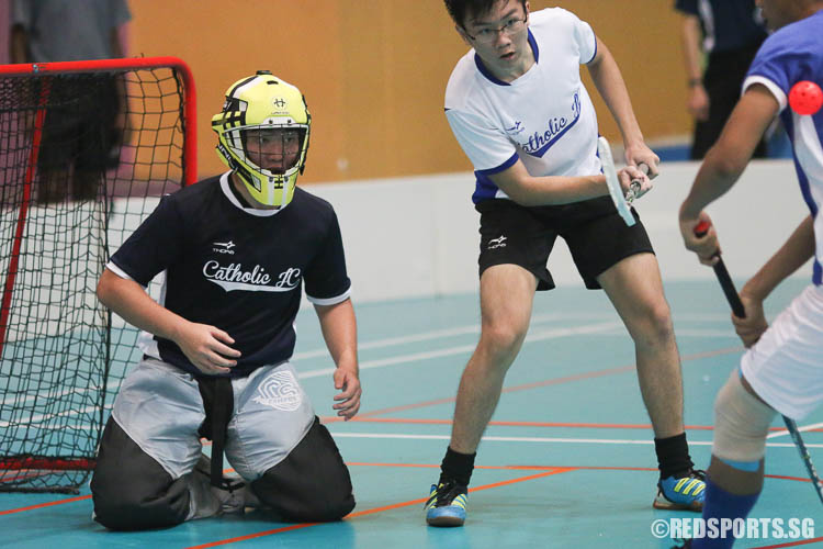 CJC goalkeeper looks on while his teammates deflects the ball. (Photo © Chua Kai Yun/Red Sports)