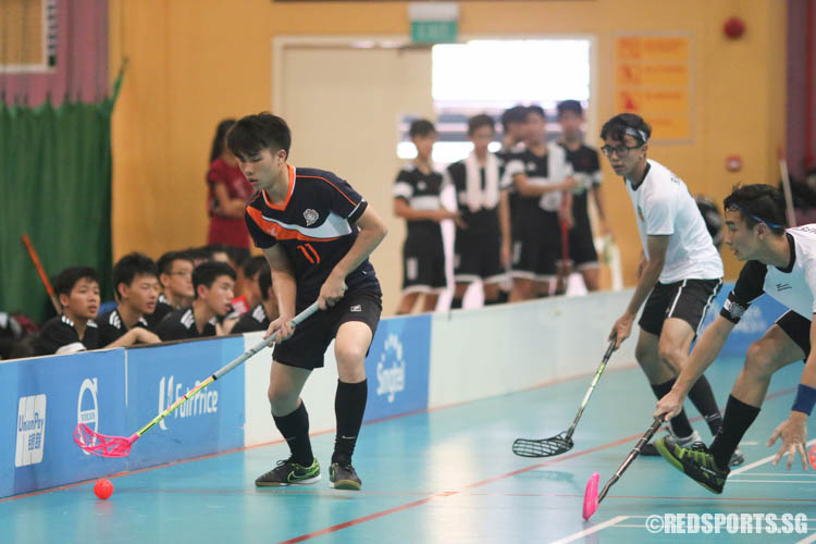 Nicholas Chai (PJC #11) dribbles the ball against Raffles Instiitution. (Photo © Chua Kai Yun/Red Sports)
