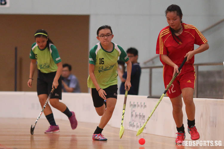 Agnes Loh (BM #12) controls the ball against Daphne Tan (OP #16). (Photo © Chua Kai Yun/Red Sports)