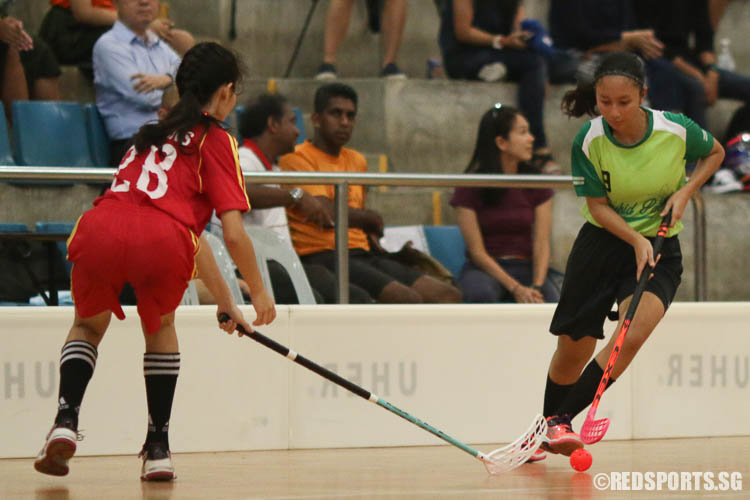 Syafiqah Edris (OP #9) steers the ball away from her opponent. (Photo © Chua Kai Yun/Red Sports)