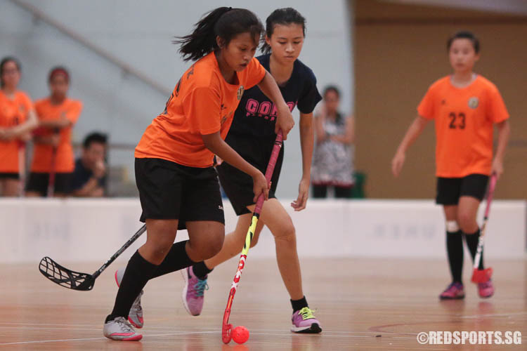 Yasmin Namira Bte Mohammade Y (TKSS #36) dribbles the ball against Erin Ng (Coral #25).(Photo © Chua Kai Yun/Red Sports)