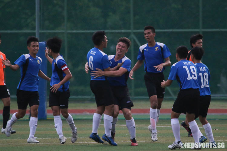 Anglo-Chinese Junior College players celebrate as Devon Gammon (ACJC #8, center) scored. (Photo © Chua Kai Yun/Red Sports)