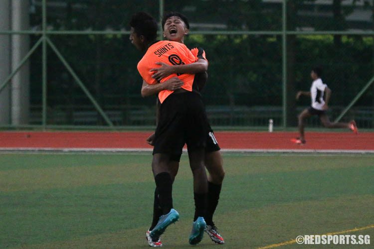 Saint Andrew's Junior College players sharing a moment after scoring a goal. (Photo © Chua Kai Yun/Red Sports)