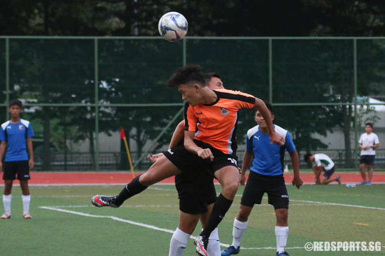 SAJC #10 going for a header. (Photo © Chua Kai Yun/Red Sports)