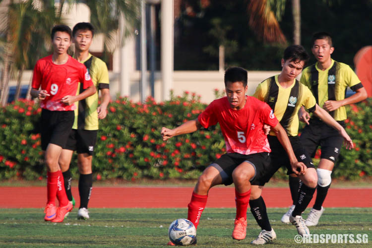 Chin Yu Xun (RVHS #5) controls the ball against TJC. (Photo © Chua Kai Yun/Red Sports)